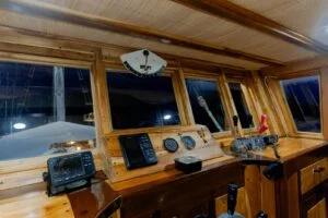 The sleek wooden interior of a phinisi boat in Labuan Bajo. — Barakati Phinisi Sailing Adventure in Komodo